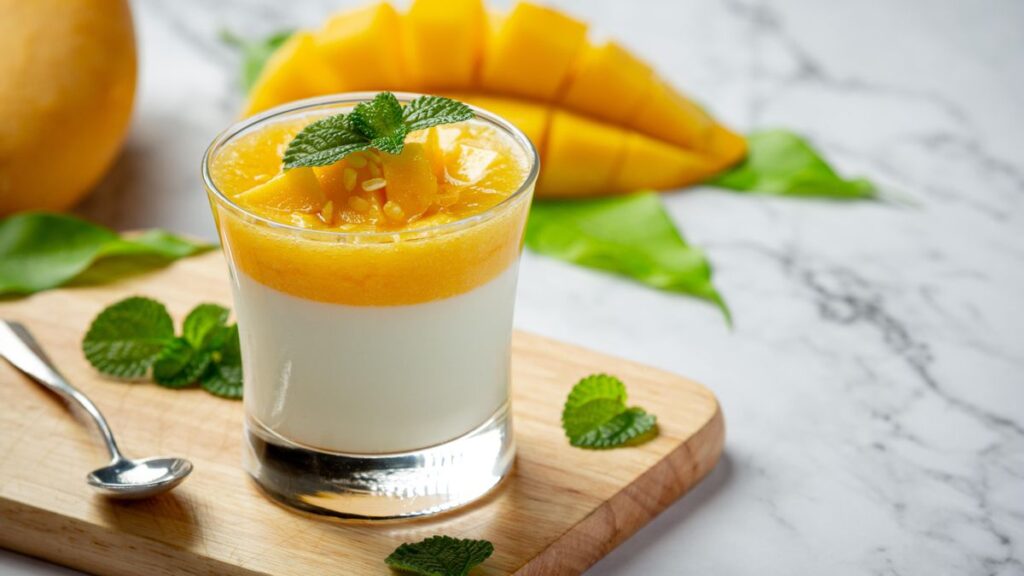 Homemade mango yoghurt on marble backgroud