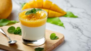 Homemade mango yoghurt on marble backgroud