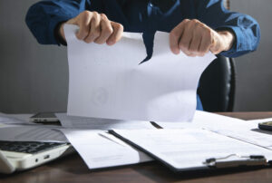 Businessman breaking contract at office.