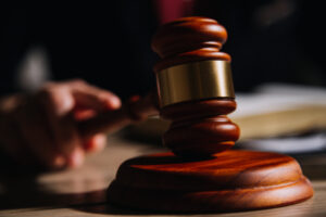 Justice and law concept.Male judge in a courtroom with the gavel
