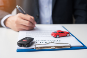 Businessman signing contract document. Rental contract, insuranc