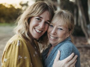 Close up portrait of adult mother and senior mother smiling outside San Diego, CA, United States PUBLICATIONxINxGERxSUIx