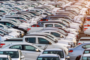 Row of new cars in port.